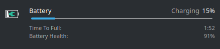 The Anker 65W charger reporting a charging time of just under 2 hours